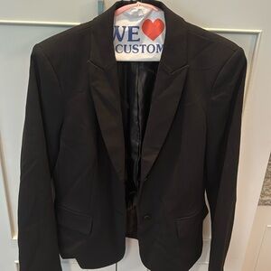 Calvin Klein black blazer, very lightly worn, two buttons, pockets w flap.